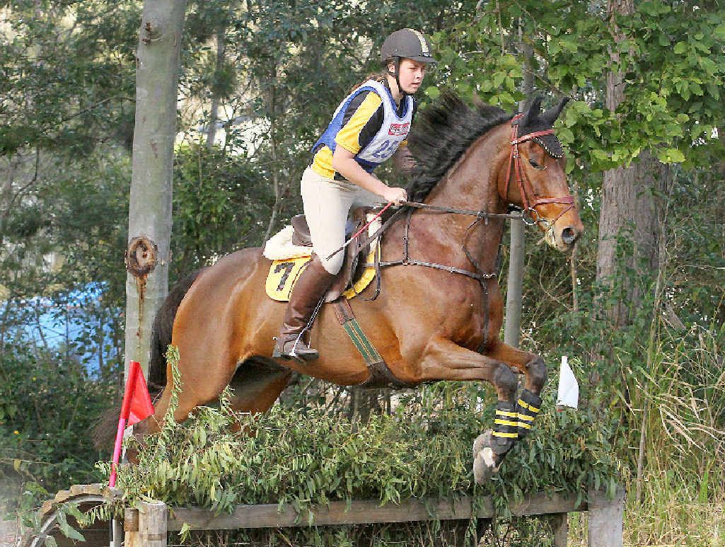JUMPING FOR JOY: Hayley Berg with her bay thoroughbred Warrigal Style. JUMPING FOR JOY: Hayley Berg with her bay thoroughbred Warrigal Style.
